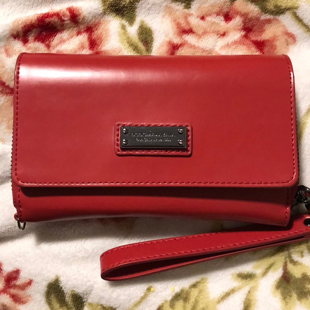 Lightly used BCBG wallet with wristlet.